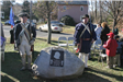 Reenactors standing by the George Washington Memorial Plaque