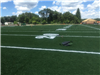 Artificial turf football yard lines and numbers being installed