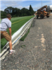 Person laying last of artificial turf