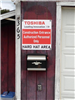 Toshiba leading innovation. Construction entrance. Authorized personnel only. Hard hat area.