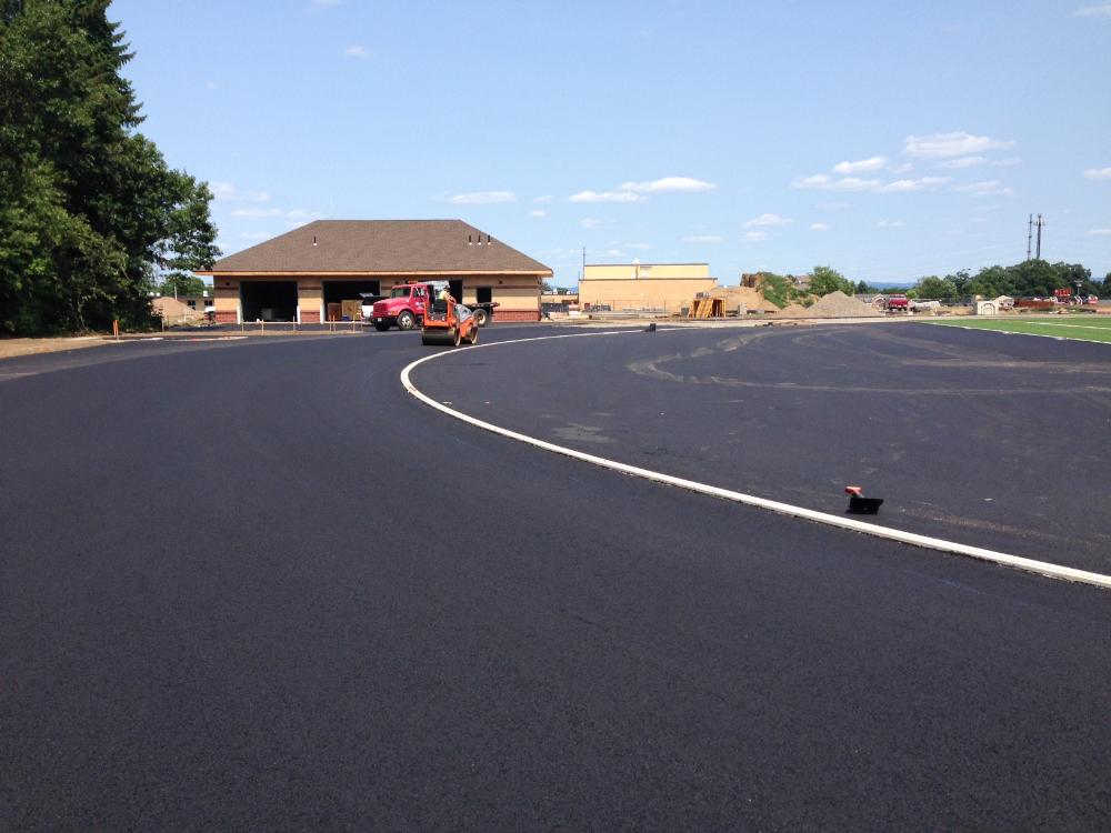 Person on roller machine leveling the track