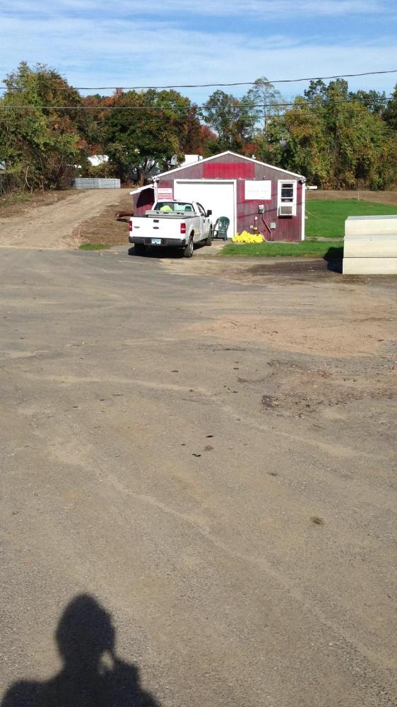 Building with a truck in front at the Main Street Solar Farm